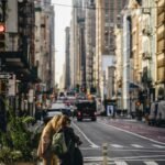 A couple of people that are standing in the street